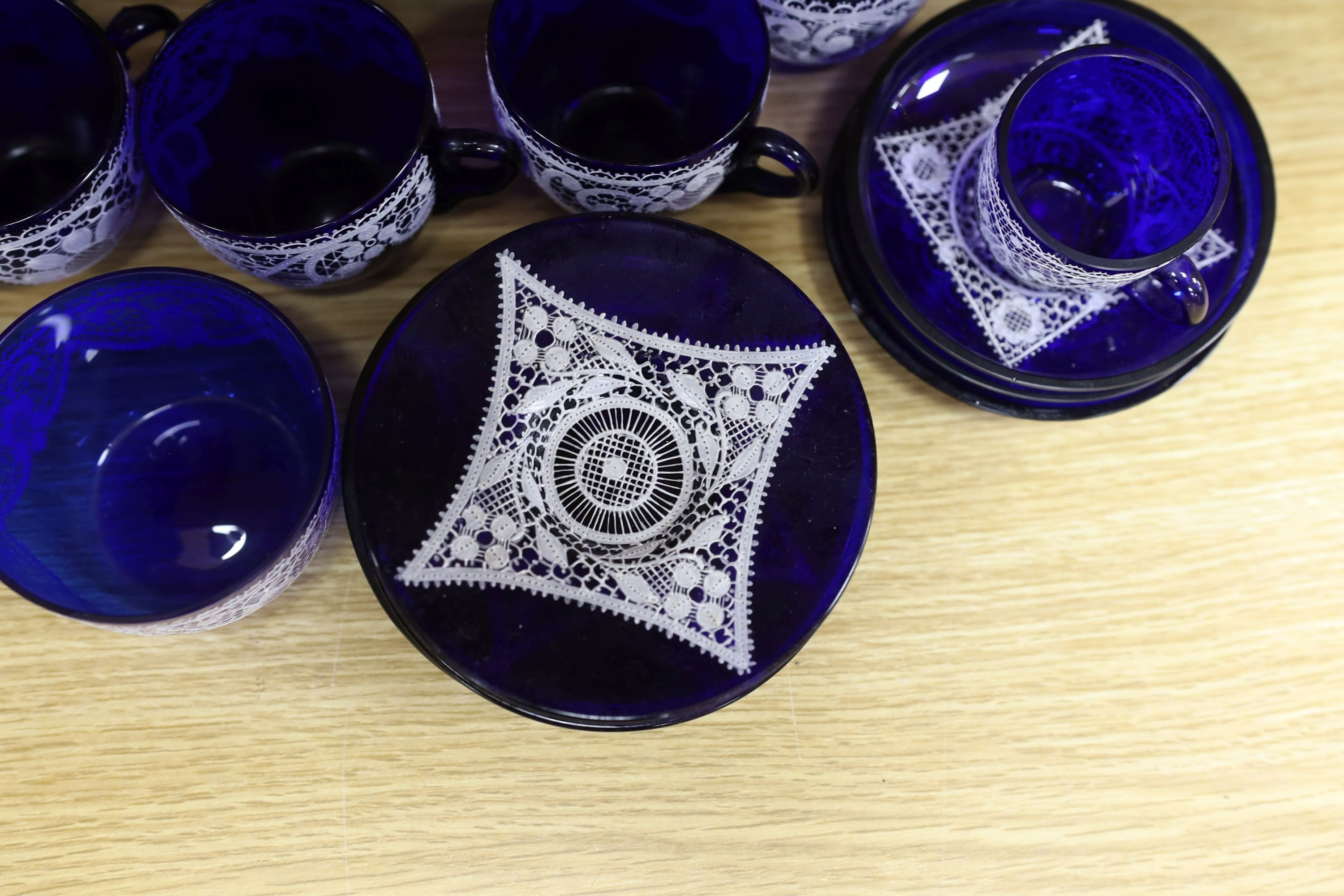 A quantity of Venetian lace pattern enamelled glass teaware